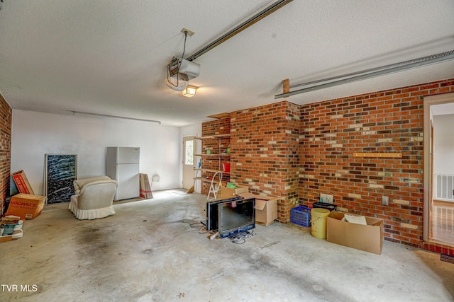 205 Donegal Way Unit 205, Bristol, TN 37620 - garage featuring freestanding refrigerator, visible vents, and a garage door opener