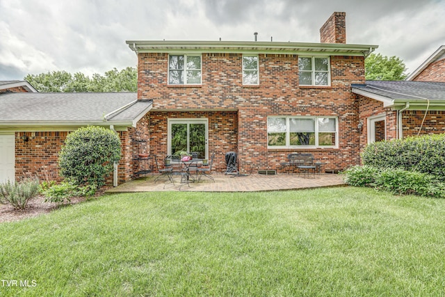 205 Donegal Way Unit 205, Bristol, TN 37620 - rear view of property featuring brick siding, a chimney, a lawn, and a patio