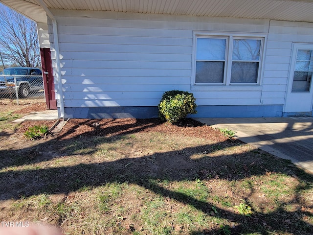 view of side of property with fence