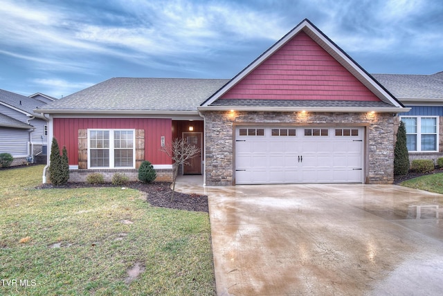 view of front of house featuring a garage and a front lawn