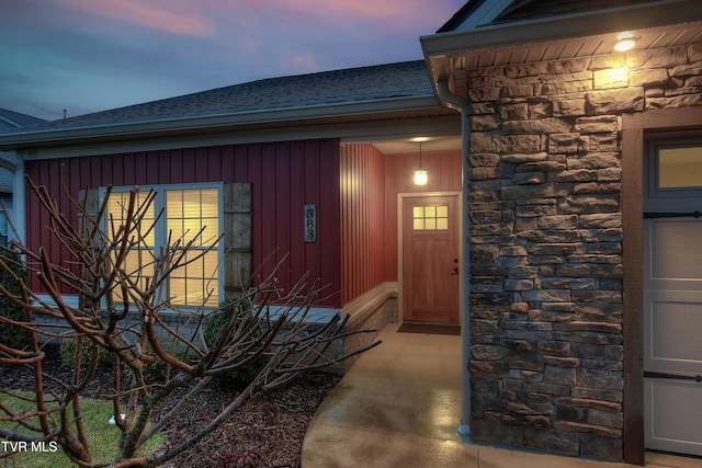 view of exterior entry at dusk