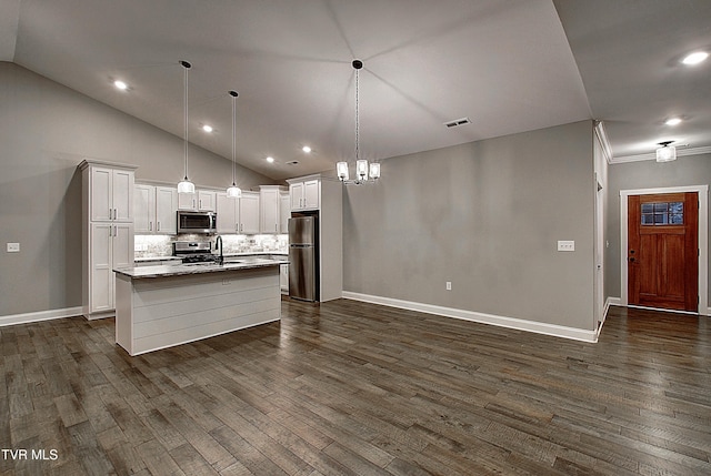 kitchen featuring a kitchen island with sink, hanging light fixtures, stainless steel appliances, white cabinets, and dark hardwood / wood-style flooring