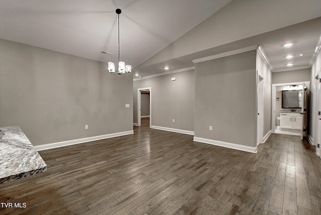 interior space featuring vaulted ceiling, crown molding, and dark hardwood / wood-style flooring