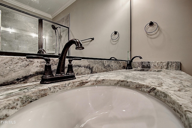 room details featuring vanity and crown molding