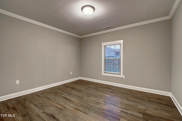 empty room with crown molding and dark hardwood / wood-style flooring