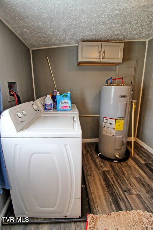 laundry area with dark wood-type flooring, water heater, cabinets, a textured ceiling, and washing machine and clothes dryer