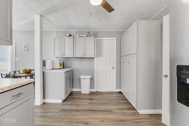 10955 Middle Wallens Creek Rd, Jonesville, VA 24263 - washroom with baseboards, a ceiling fan, wood finished floors, and a textured ceiling
