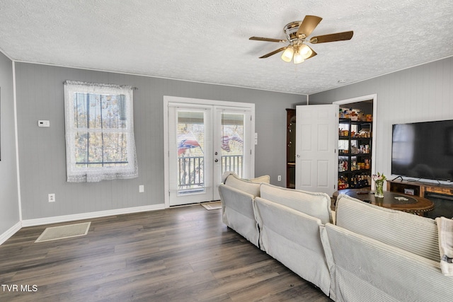 10955 Middle Wallens Creek Rd, Jonesville, VA 24263 - living room featuring french doors, a textured ceiling, a ceiling fan, and wood finished floors