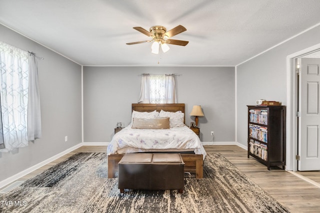10955 Middle Wallens Creek Rd, Jonesville, VA 24263 - bedroom with wood finished floors, ceiling fan, baseboards, and ornamental molding