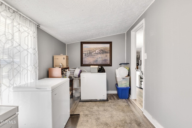 10955 Middle Wallens Creek Rd, Jonesville, VA 24263 - clothes washing area with light wood-type flooring, separate washer and dryer, and laundry area