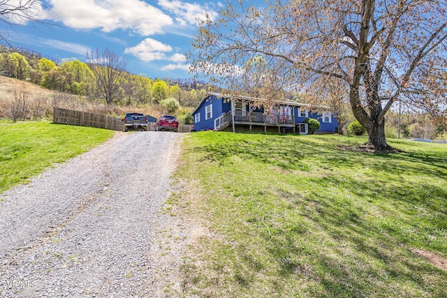 10955 Middle Wallens Creek Rd, Jonesville, VA 24263 - view of front facade with a deck, driveway, and a front lawn