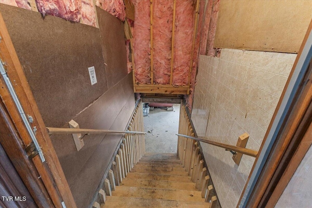 staircase featuring wood finished floors