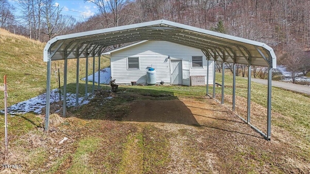 view of parking / parking lot featuring a detached carport