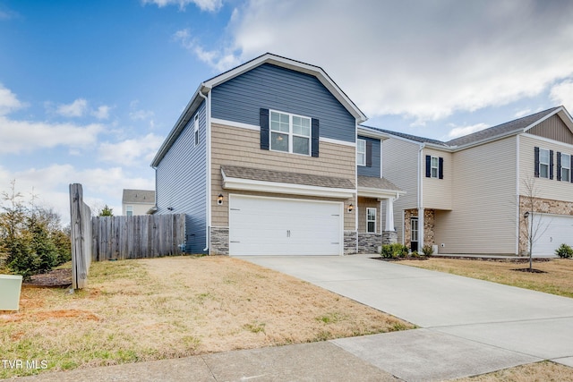 view of front facade with a garage and a front yard