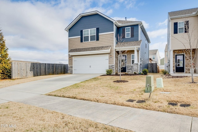 view of front of property with a front lawn and a garage