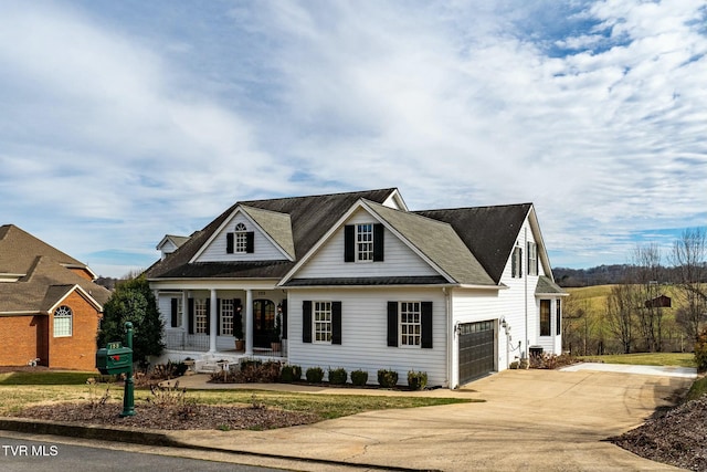 view of front of property with concrete driveway and an attached garage