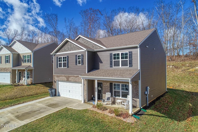 view of front of home with a porch, a garage, and a front yard