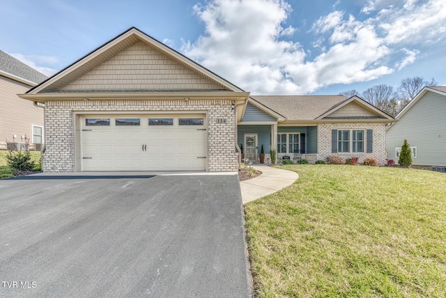 view of front of property with a garage and a front yard