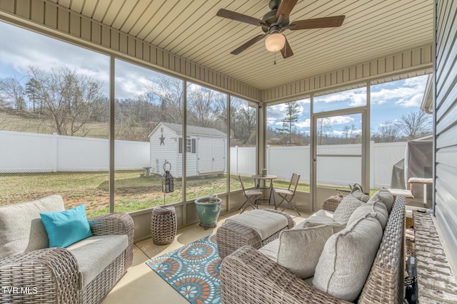 sunroom / solarium with a wealth of natural light and ceiling fan