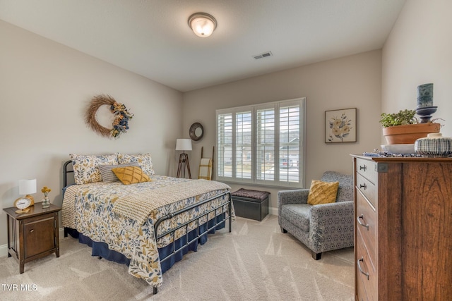 bedroom with light carpet