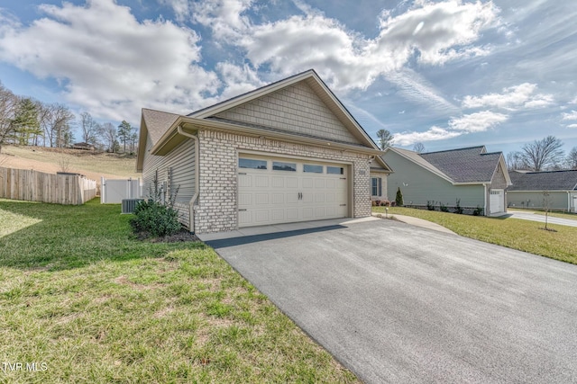 view of front of house featuring a front yard and a garage