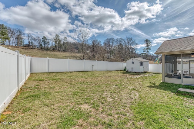 view of yard featuring a shed and a sunroom