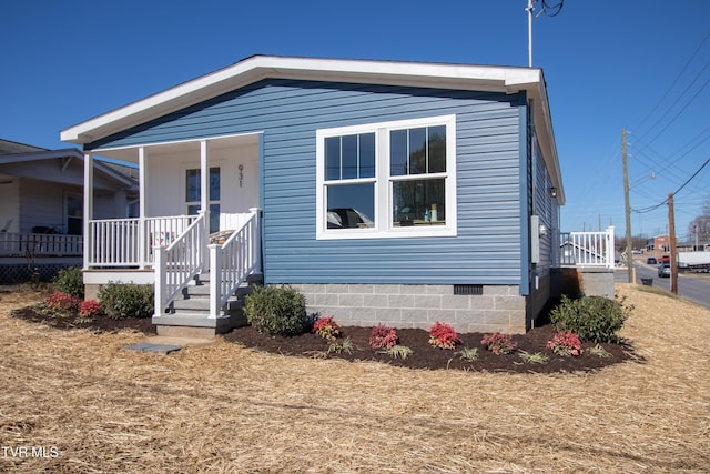 view of front of house with crawl space and covered porch