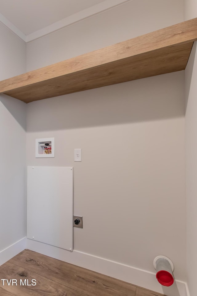 laundry area featuring hookup for a washing machine, laundry area, wood finished floors, baseboards, and electric dryer hookup