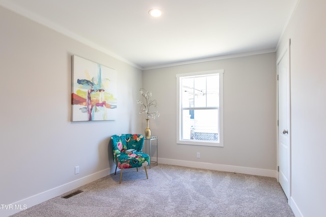 living area with carpet, visible vents, crown molding, and baseboards