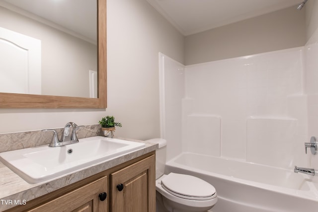 bathroom featuring bathing tub / shower combination, vanity, and toilet