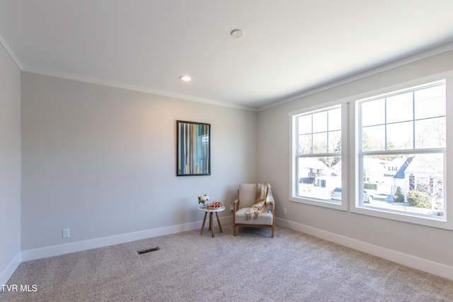 unfurnished room with baseboards, crown molding, visible vents, and carpet flooring