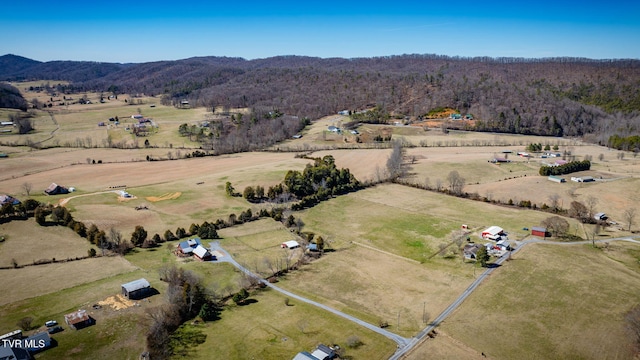 drone / aerial view with a rural view, a mountain view, and a view of trees