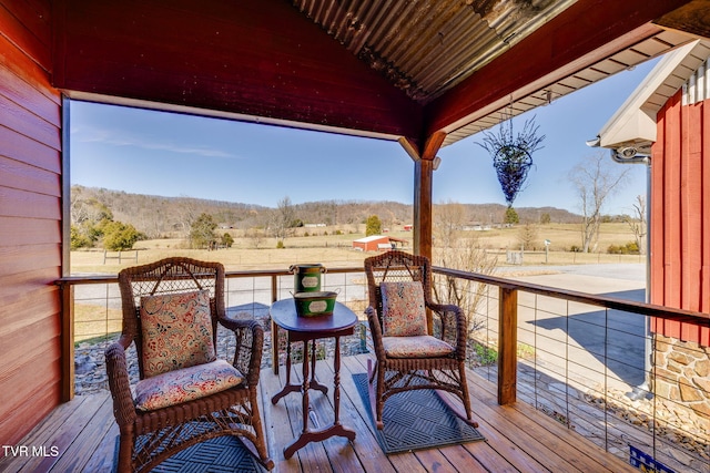 wooden terrace with a rural view