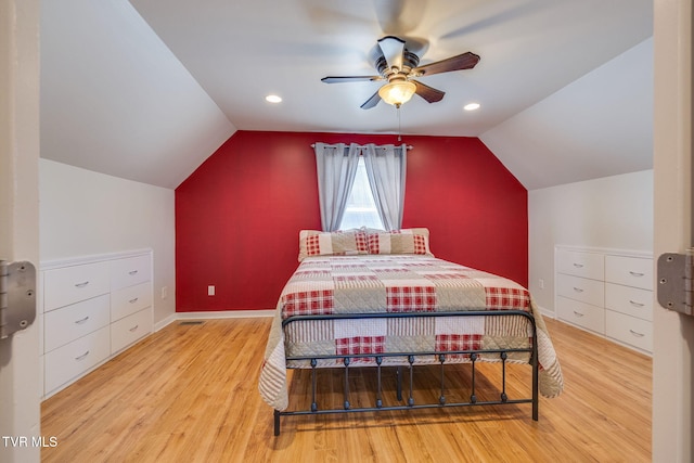 bedroom with baseboards, a ceiling fan, lofted ceiling, wood finished floors, and recessed lighting