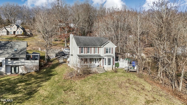 view of front of home featuring a front yard and a porch