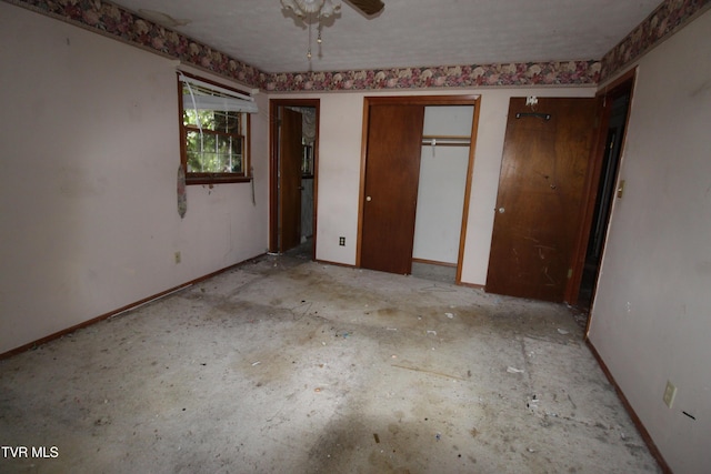 unfurnished bedroom featuring two closets