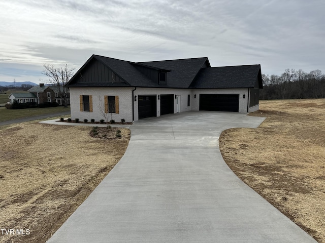 modern inspired farmhouse with a garage