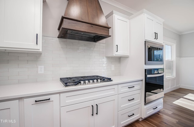294 River Pointe Dr, Greeneville, TN 37743 - kitchen with dark wood-type flooring, oven, built in microwave, custom exhaust hood, and stainless steel gas cooktop
