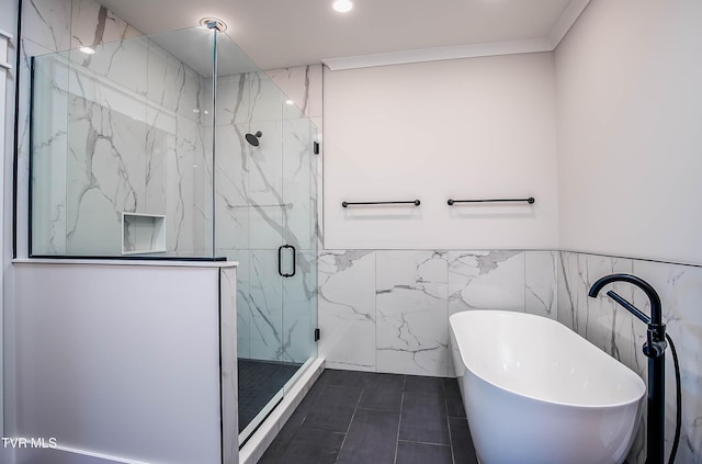 294 River Pointe Dr, Greeneville, TN 37743 - bathroom with a wainscoted wall, tile walls, a soaking tub, a marble finish shower, and crown molding
