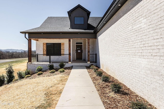 294 River Pointe Dr, Greeneville, TN 37743 - view of exterior entry featuring covered porch and brick siding