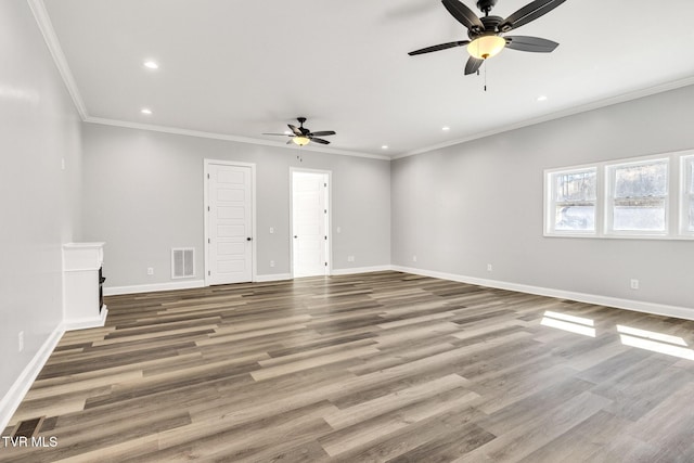 spare room featuring recessed lighting, visible vents, baseboards, and wood finished floors