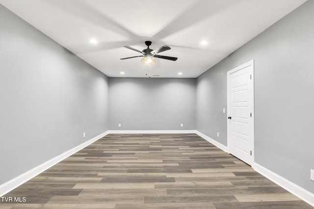 empty room with wood finished floors and baseboards