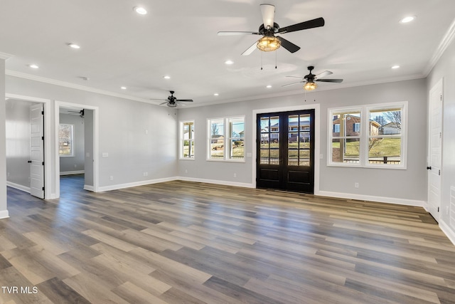 unfurnished living room featuring crown molding, french doors, wood finished floors, and recessed lighting