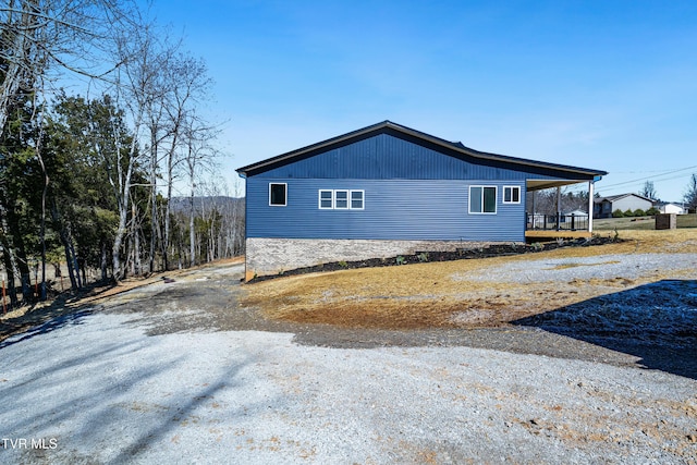 view of side of property with driveway