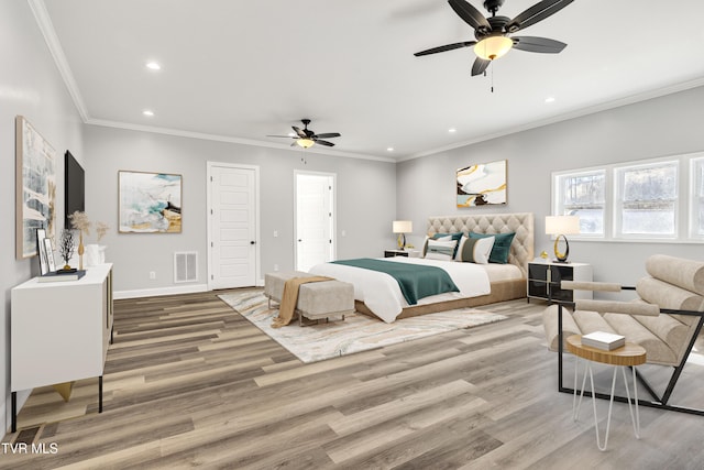 bedroom with crown molding, wood finished floors, visible vents, and recessed lighting