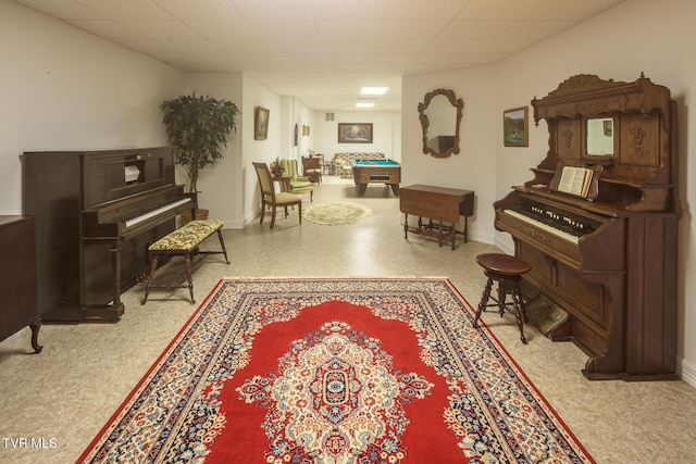 sitting room featuring pool table, a drop ceiling, and baseboards