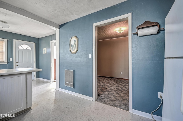 interior space with a textured ceiling