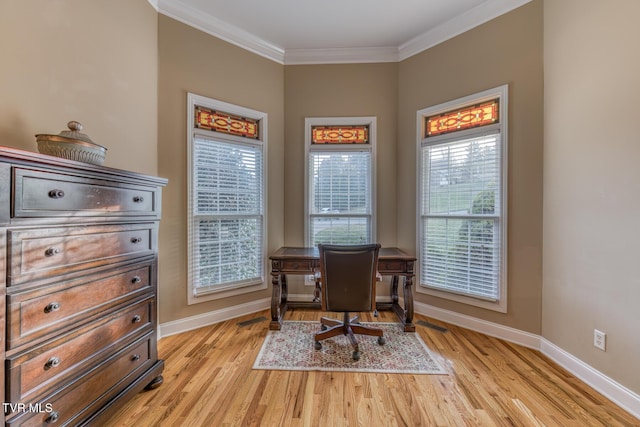 home office featuring ornamental molding, light wood-style floors, and baseboards