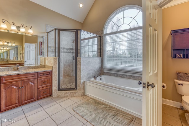 bathroom featuring a shower stall, vanity, a bath, and tile patterned floors