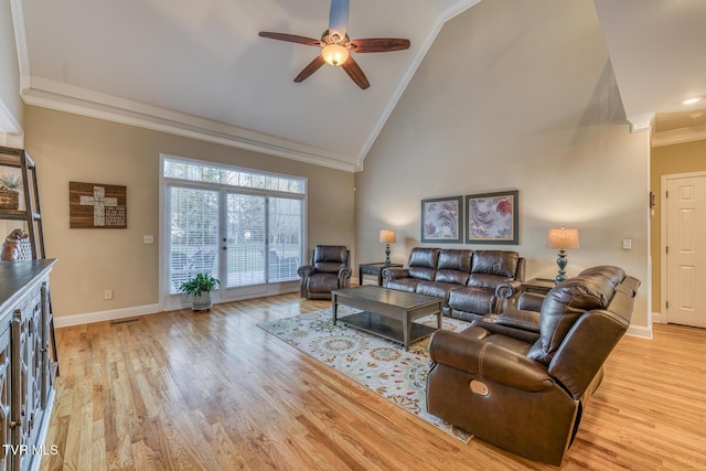 living room featuring high vaulted ceiling, light wood-style flooring, a ceiling fan, baseboards, and ornamental molding